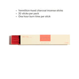 Box of vermilion-hued charcoal incense sticks with product details on a white background